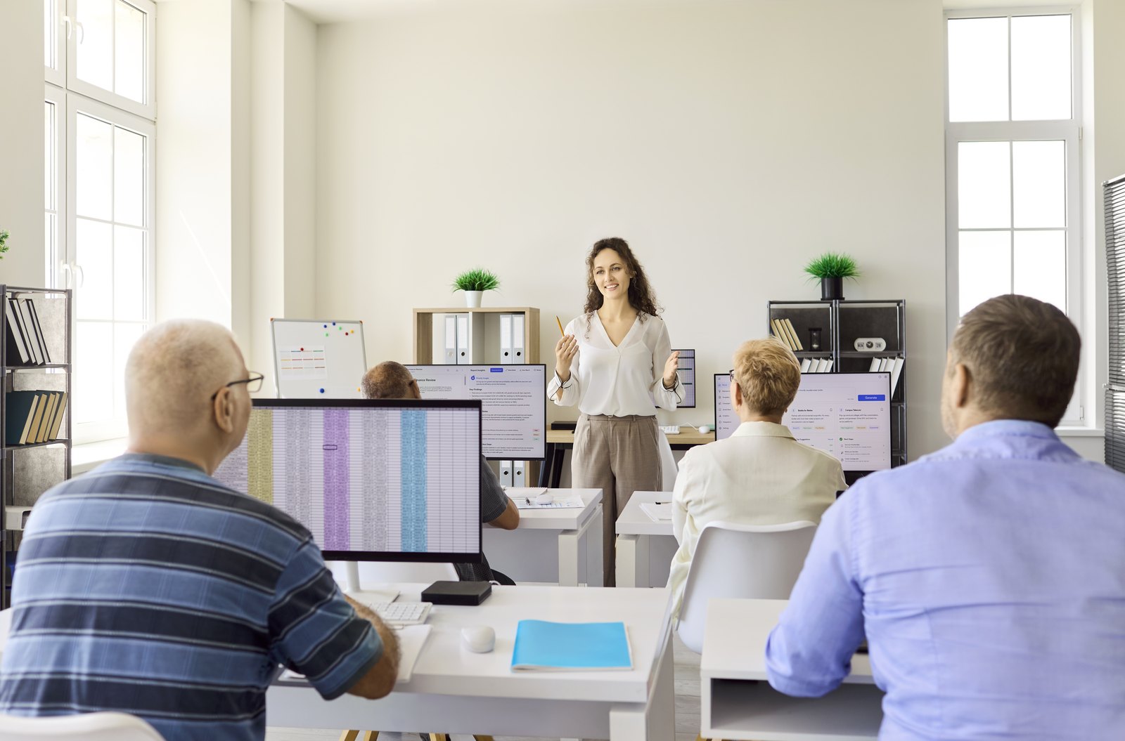 Staff learning together in a computer training session